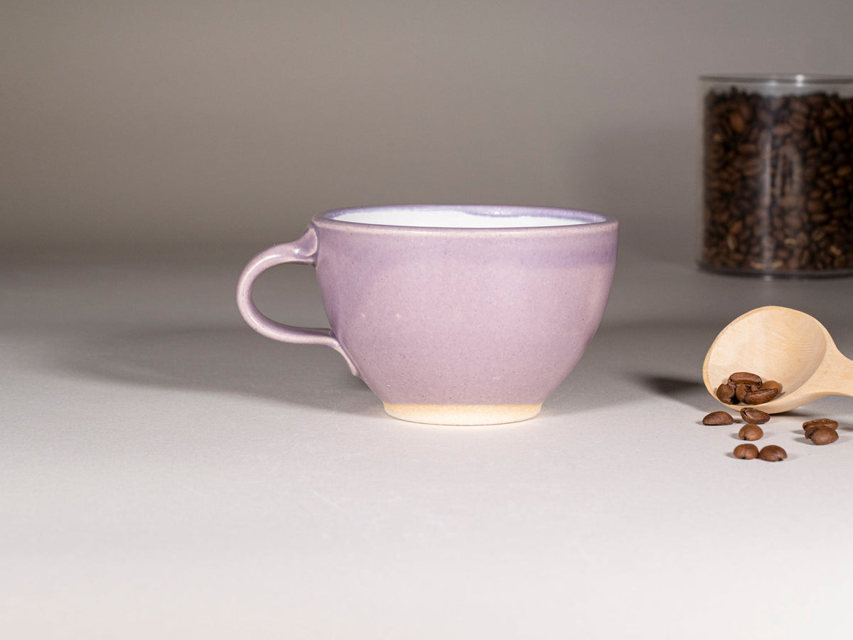 Purple stoneware cup with handle and saucer, cream base glaze, latte size 10–12 oz