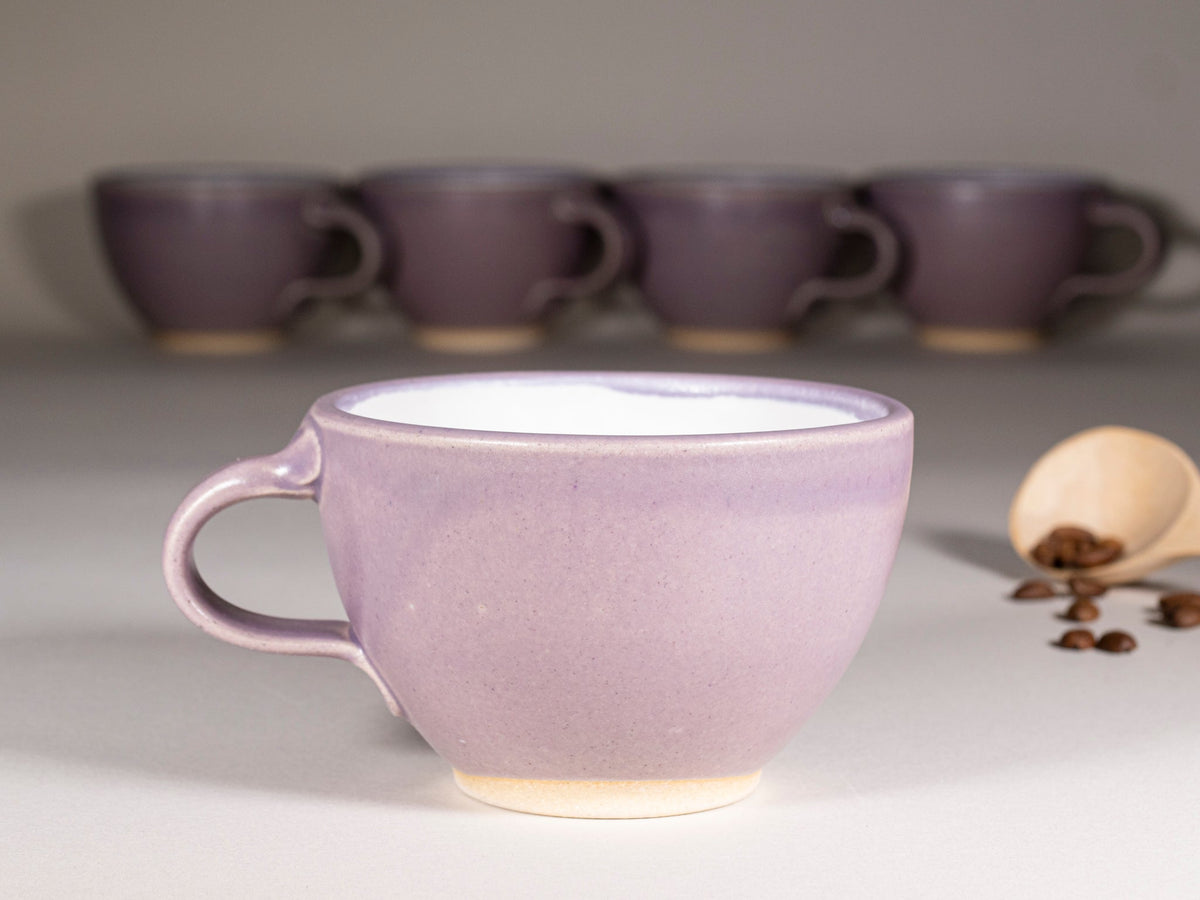 Purple stoneware latte cup with handle and saucer, cream base glaze, set of cups