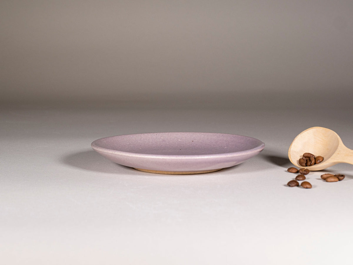 Purple stoneware saucer in matching glaze, part of a latte cup set