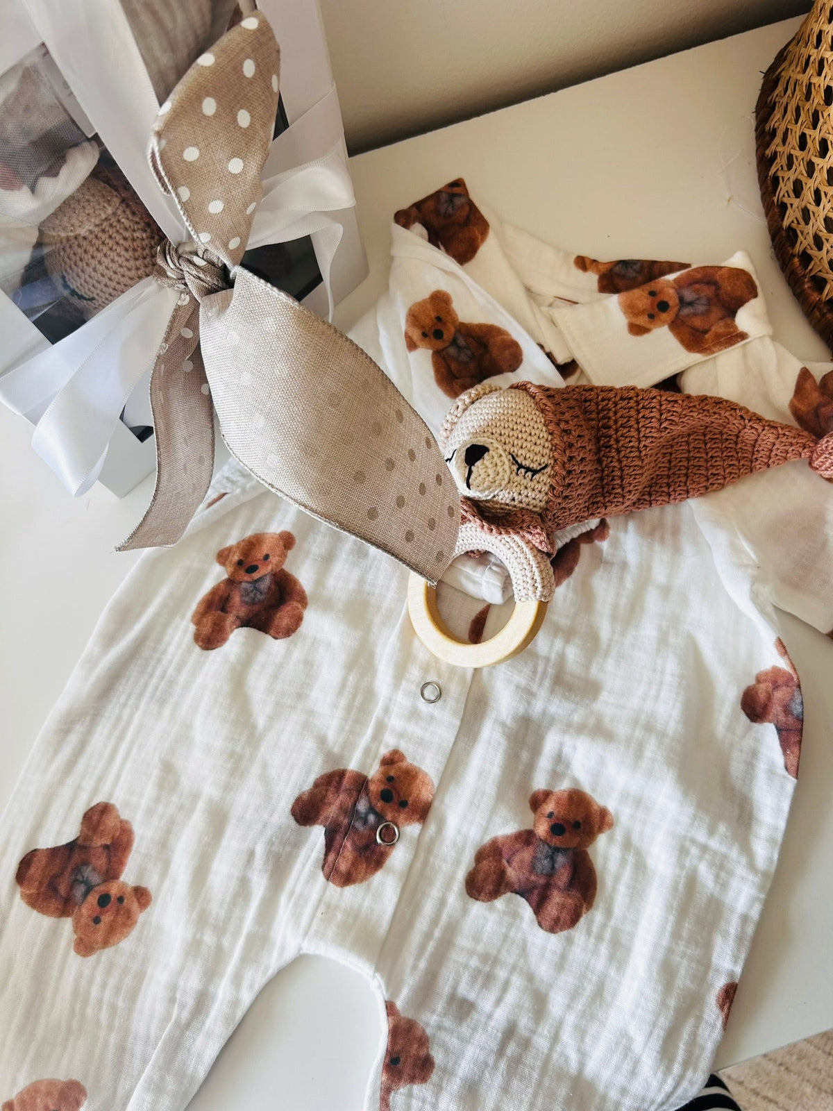 Bear-print baby romper with plush teddy bear rattle and round teething ring