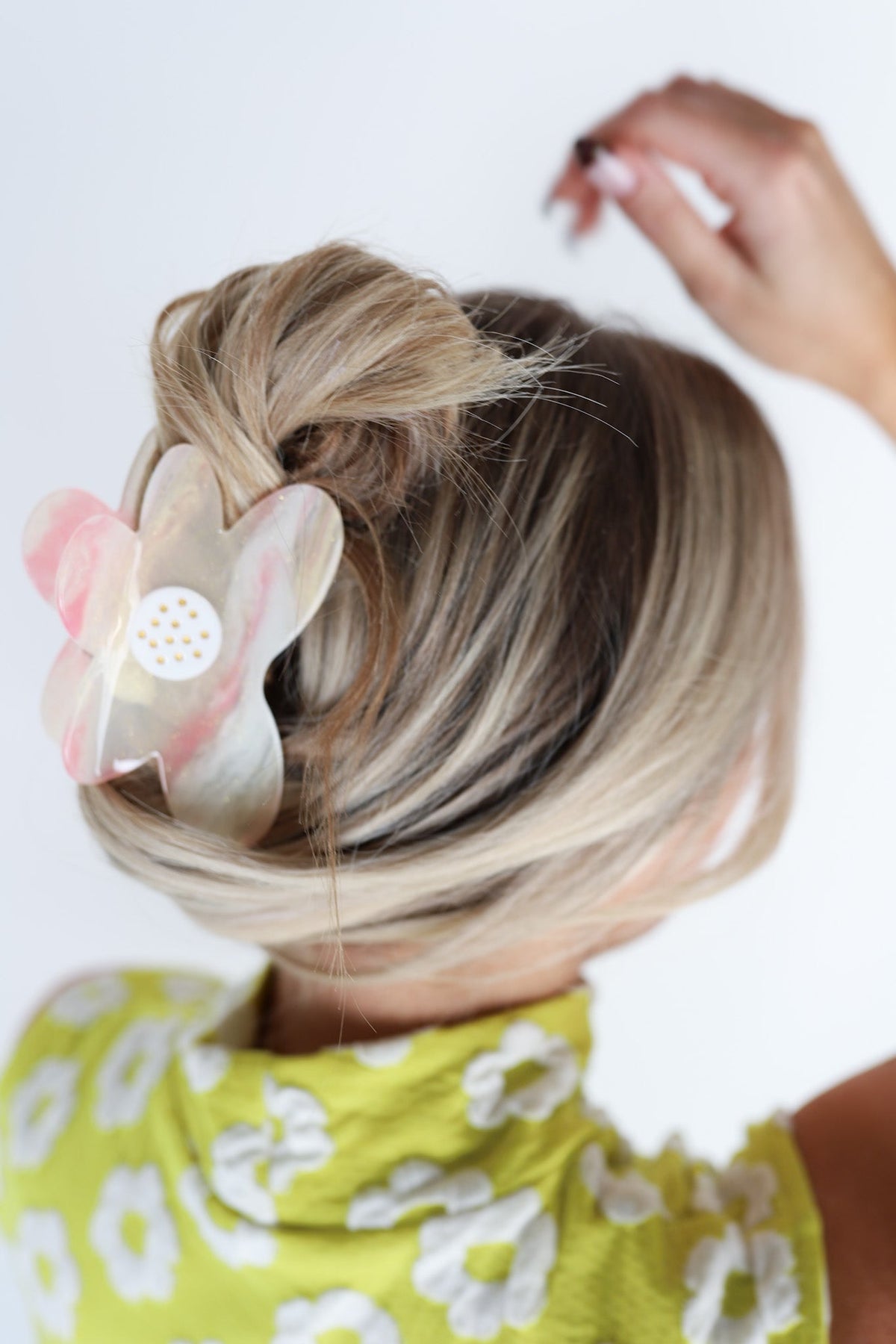 White and pink translucent floral hair claw clip with polka-dot center
