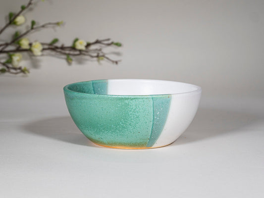 Green and white stoneware soup bowl, side view