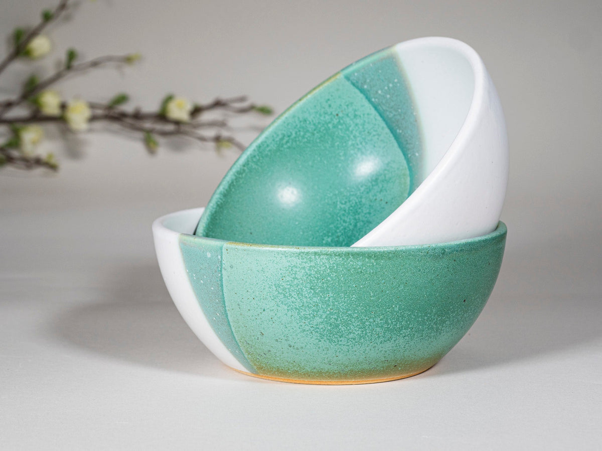 Green speckled interior stoneware soup bowl with white exterior