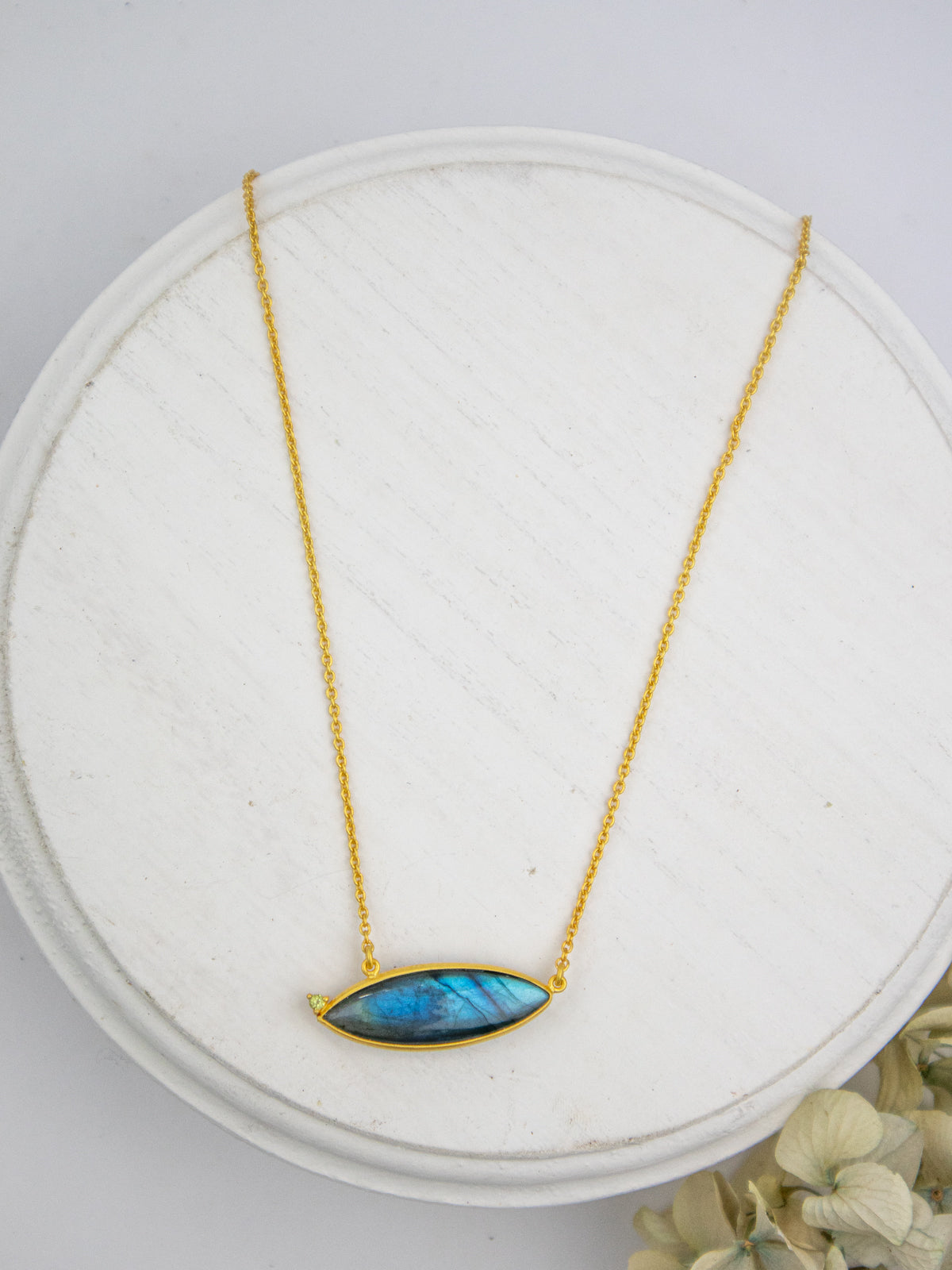 Gold chain necklace with oval blue labradorite-style pendant