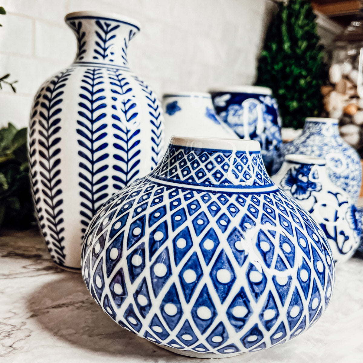 Large blue-and-white ceramic vase with geometric lattice pattern