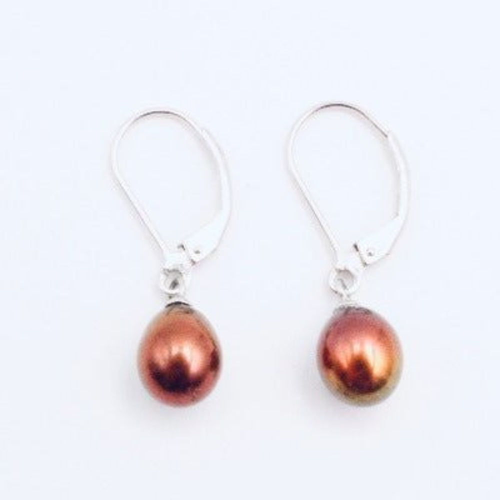 Rust-colored pearl drop earrings with silver-tone lever-back hooks