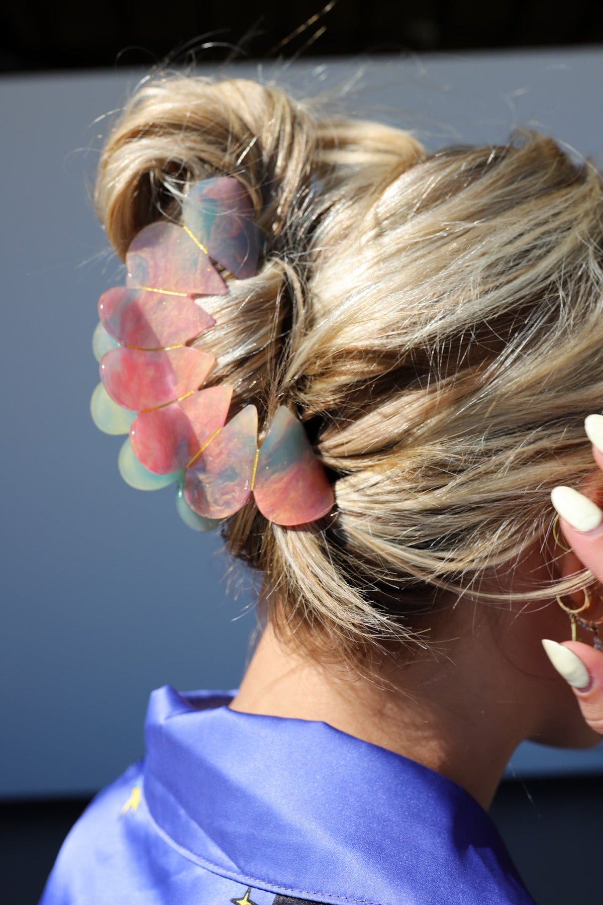 Close-up of pastel heart hair claw clip on blonde bun