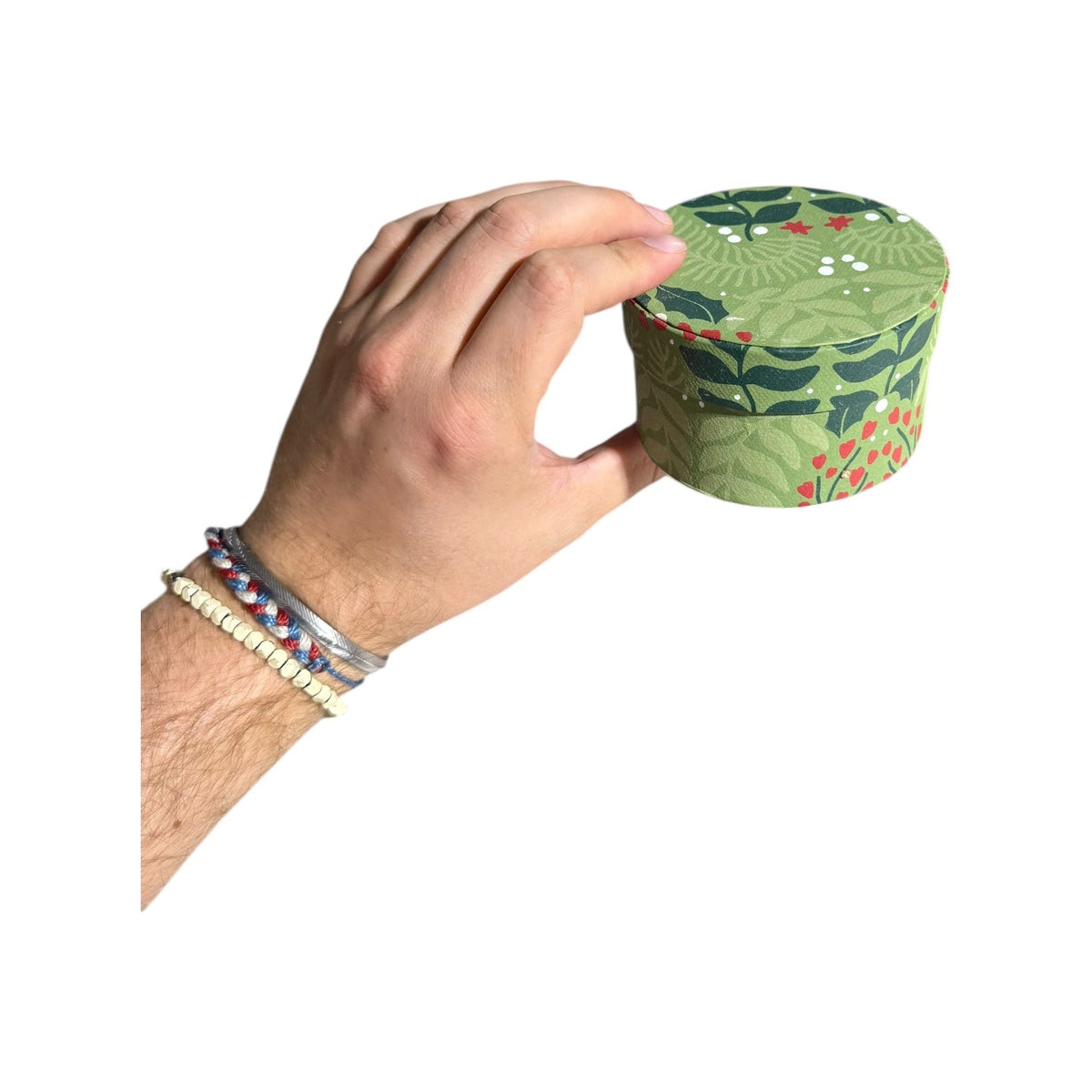 Round light-green botanical nesting gift box with leaf and berry pattern, handmade recycled paper