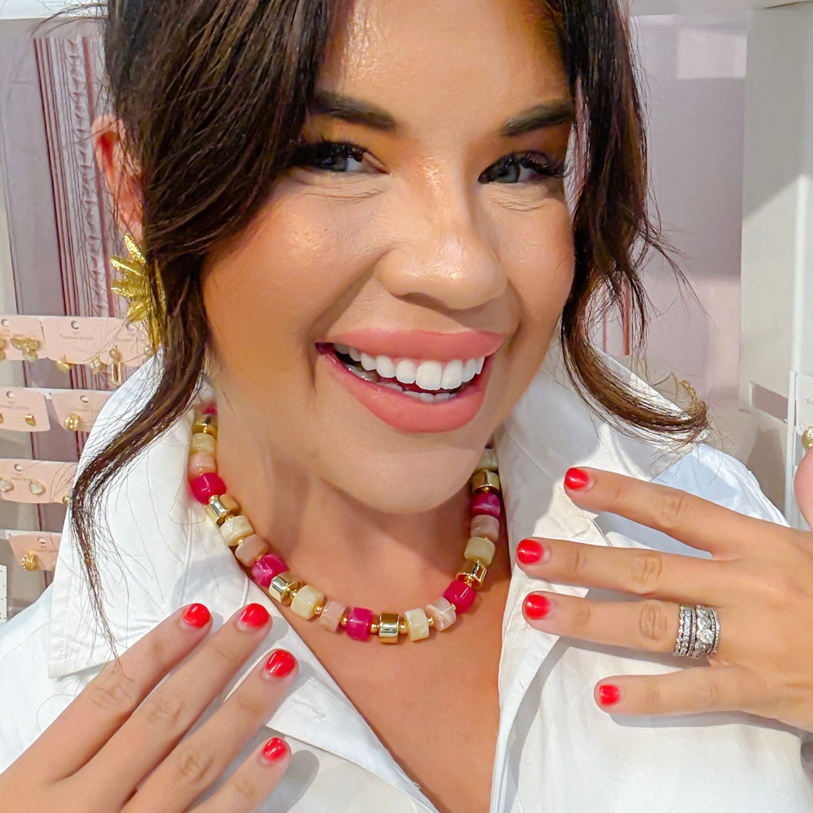 Necklace worn with pink, white, and clear cube beads and gold-tone caps
