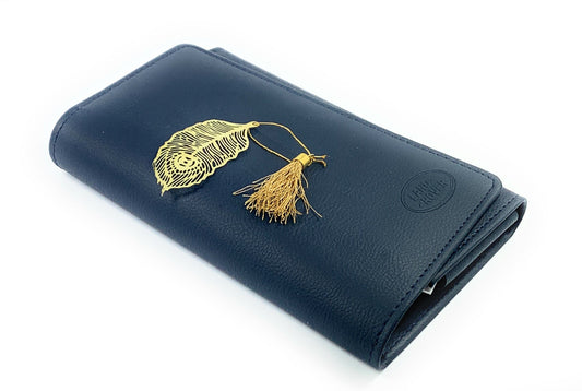 Feather bookmark with tassel on dark blue notebook cover