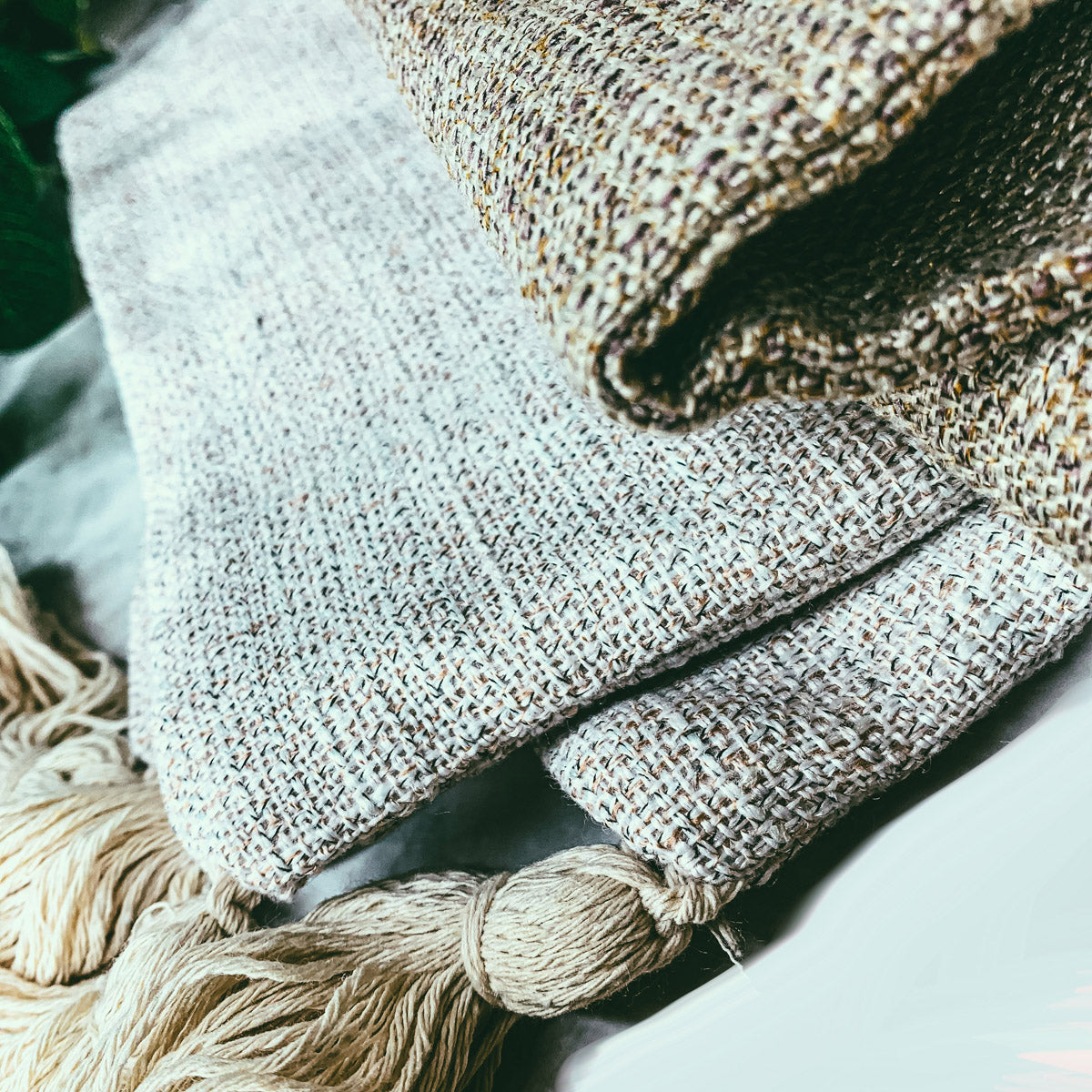 Boho cottage pillow case in ivory textured weave with knotted tassel detail.