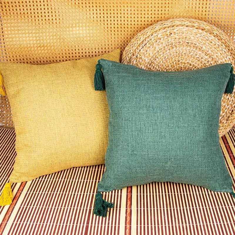 Boho cottage pillow case in teal green with tassels and corner tie detail.