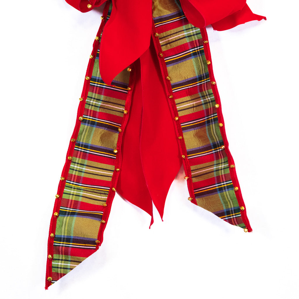 Plaid ribbon bow with long tails, red bell-edged loops, and gold studs