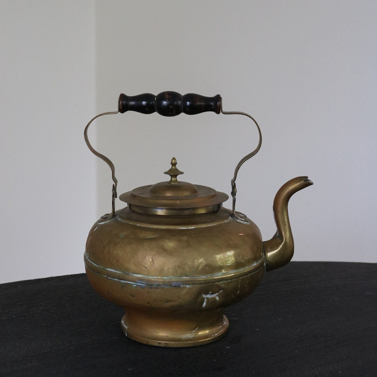 Brass and copper kettle with brass domed lid, black knob, and side handles