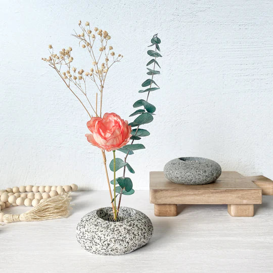 Speckled stone ikebana vase with wide circular opening for flower stems