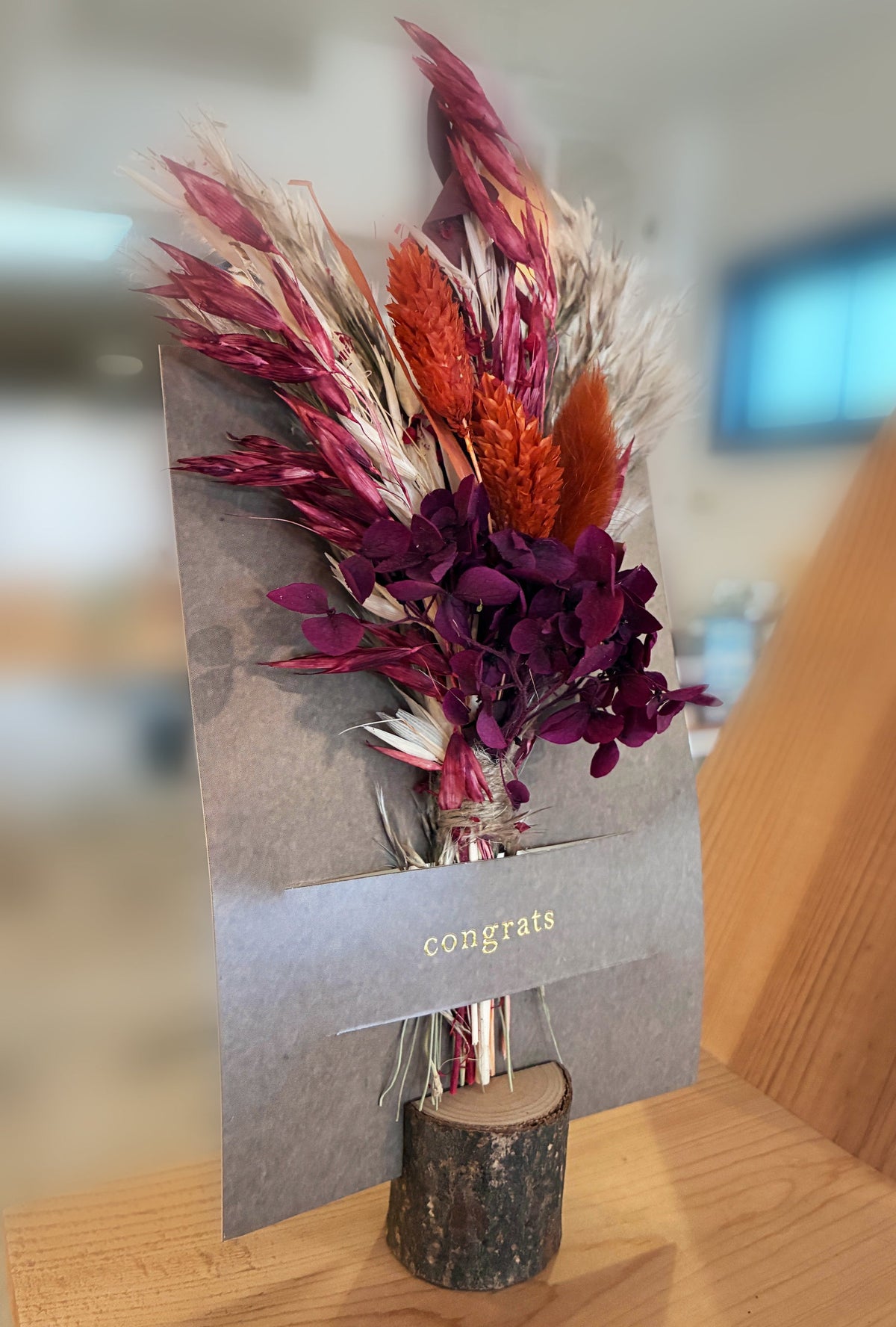 Mini dried floral greeting card with burgundy bouquet and “congrats” message on kraft paper