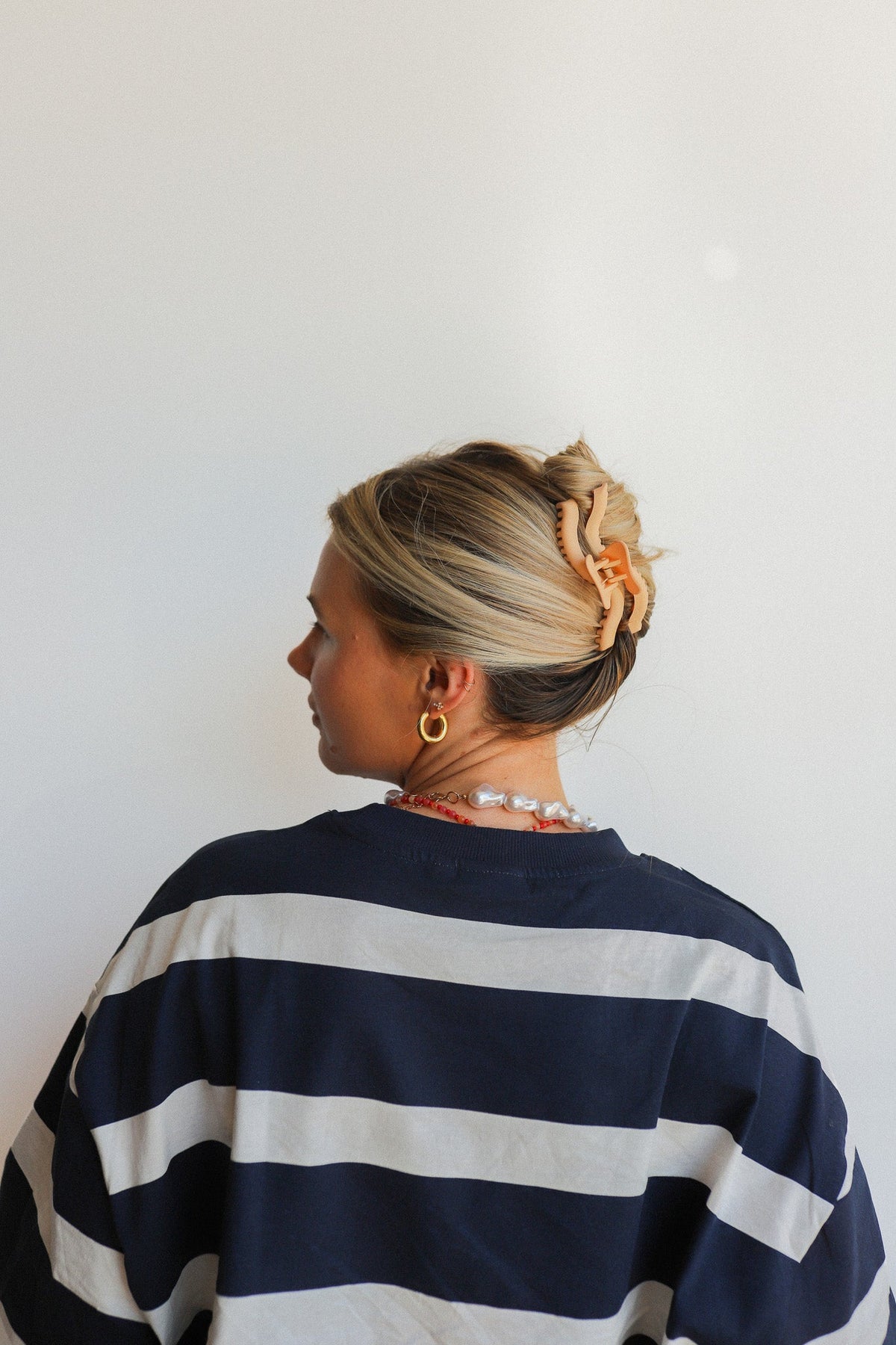 Wavy hold-them hair claw in hair bun, viewed from the back