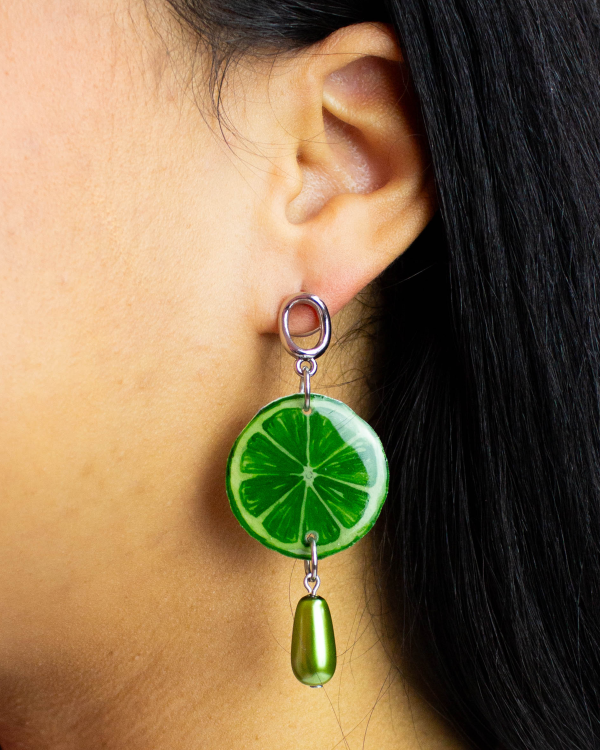 Lime drop earring with a green citrus slice charm and matching bead