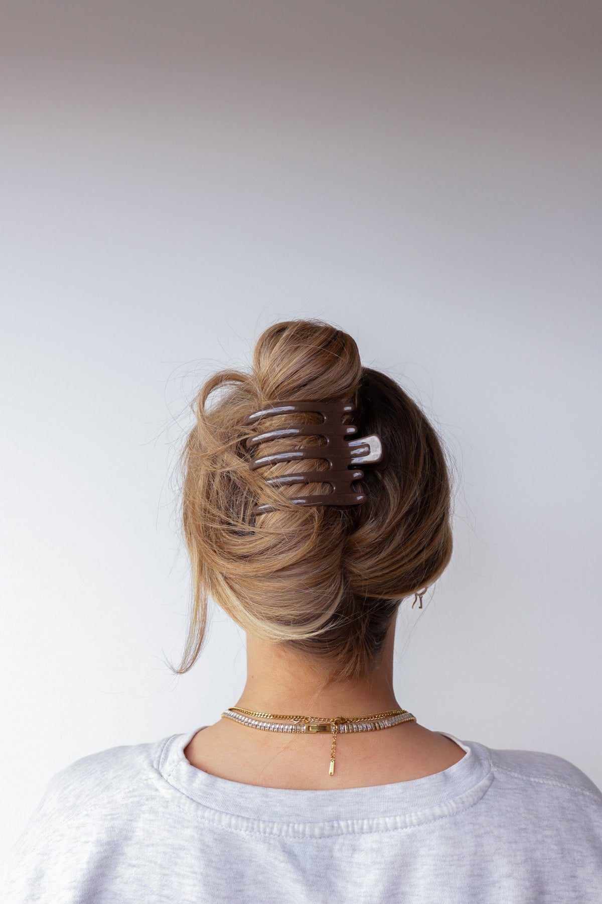 Wide hair claw clip in medium brown glossy tortoise tone