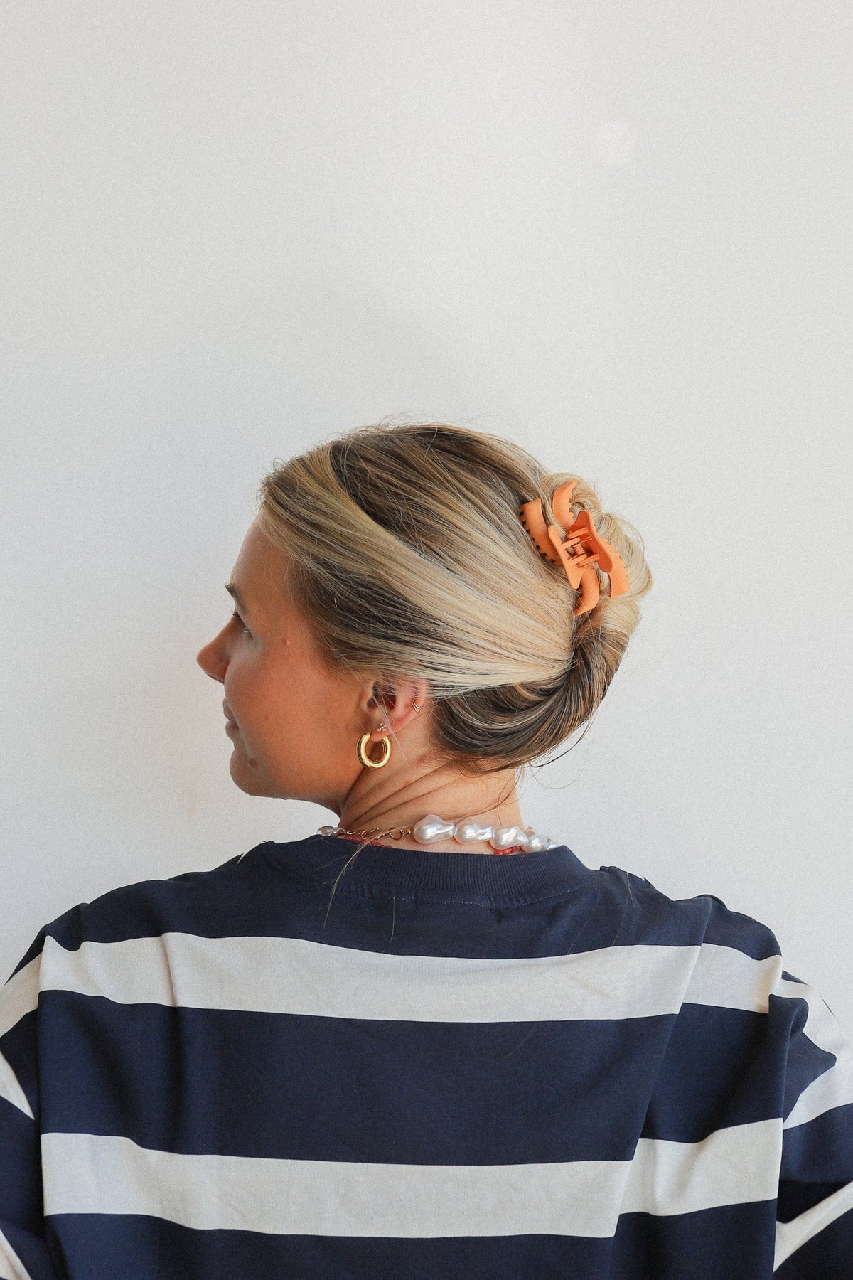 Wavy mini hair claw, orange finish with textured sculpted shape