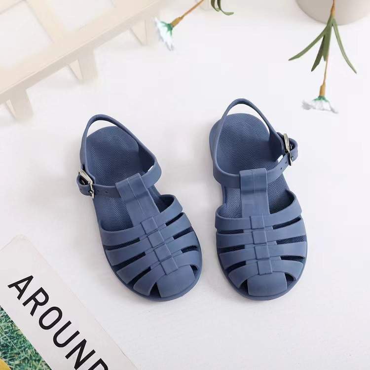 Kids' navy blue jelly sandals with buckled ankle strap and open toe