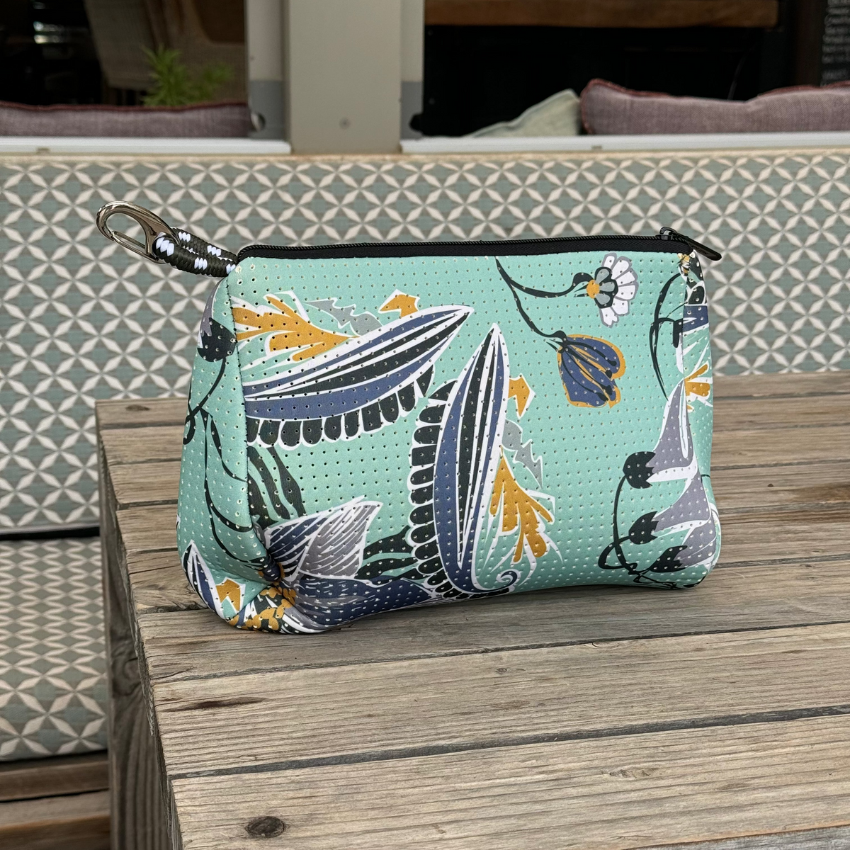 Mint zip pouch with botanical print in teal and navy, metal keyring pull