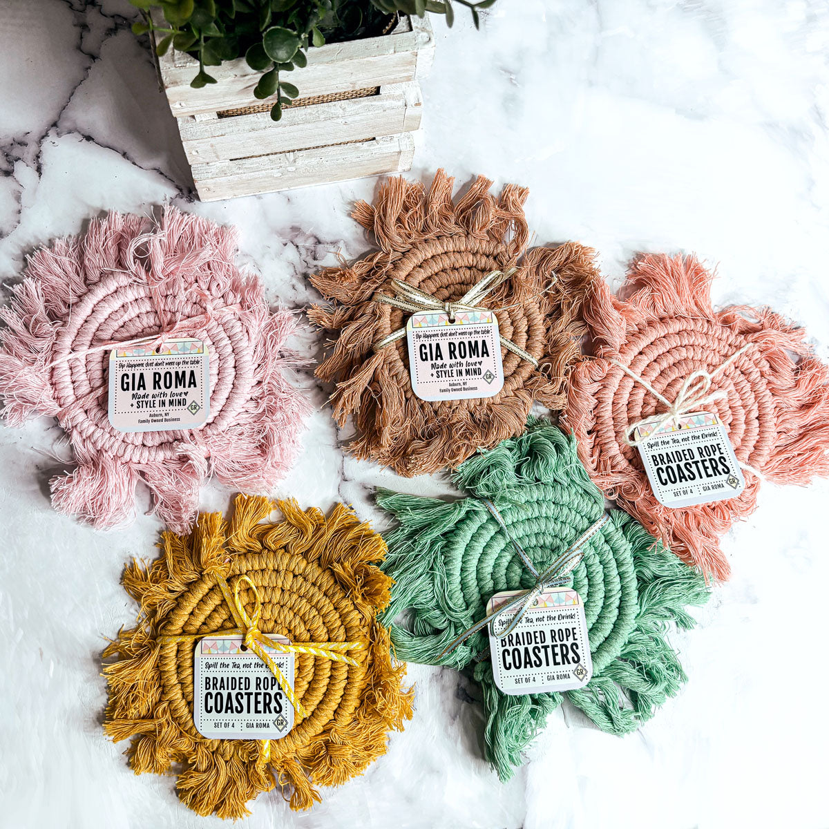 Braided rope tassel coasters set in pink, brown, green, yellow, and coral with labels