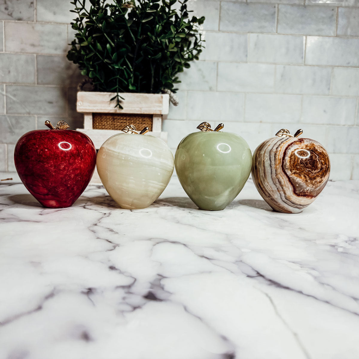 Apple paperweight set of red, white, green, and agate stone apples with gold-tone tops