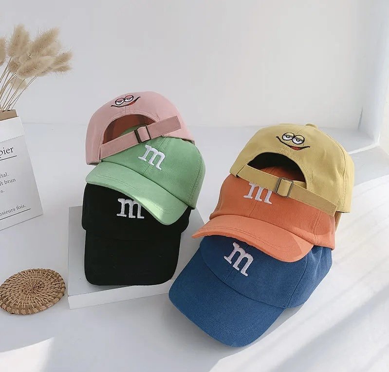 Kids baseball caps, pink and green with cartoon logo patches and adjustable strap
