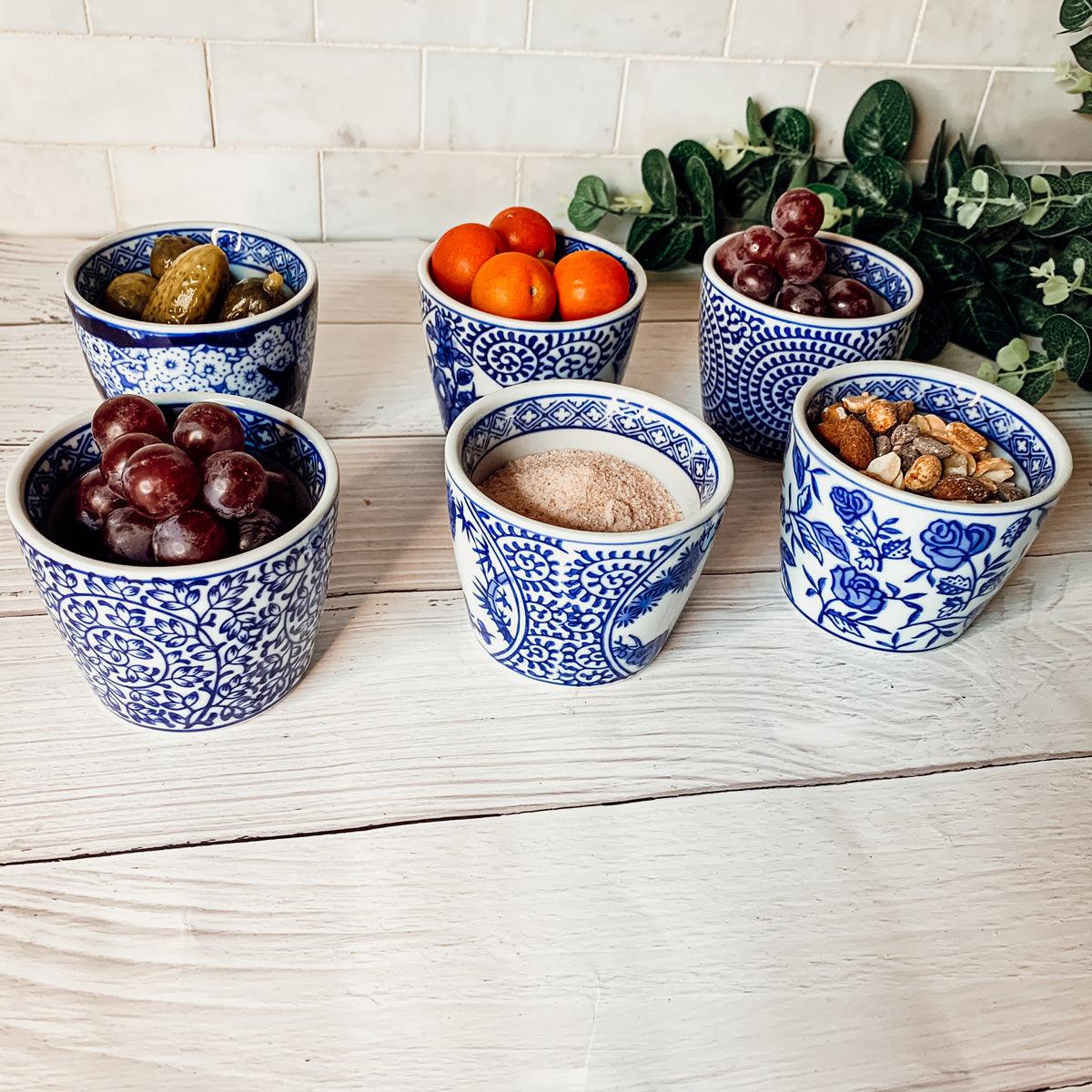 Mini chinoiserie cachepots set of small blue-and-white patterned ceramic bowls with fruit and nuts