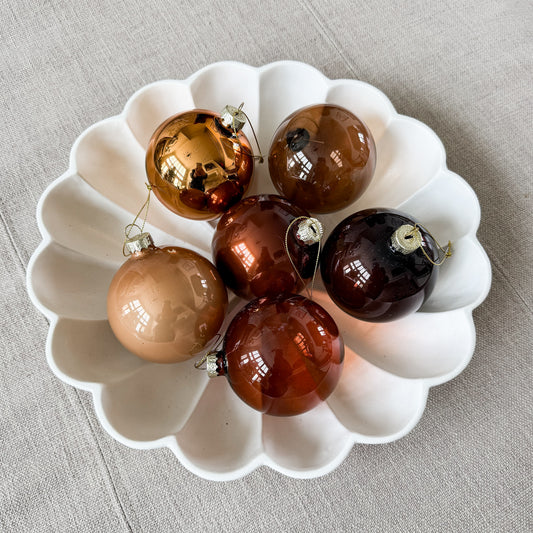 Set of brown glass Christmas ornaments with metal caps and hanging loops