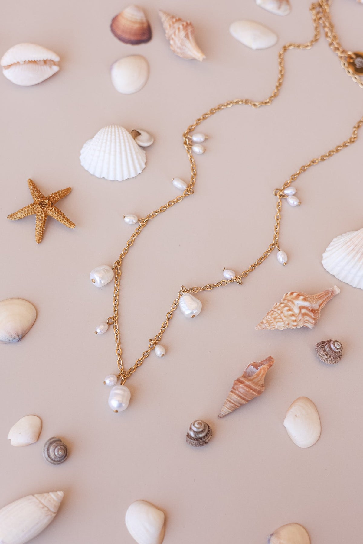 Gold Calypso Necklace with delicate chain and scattered pearl drops