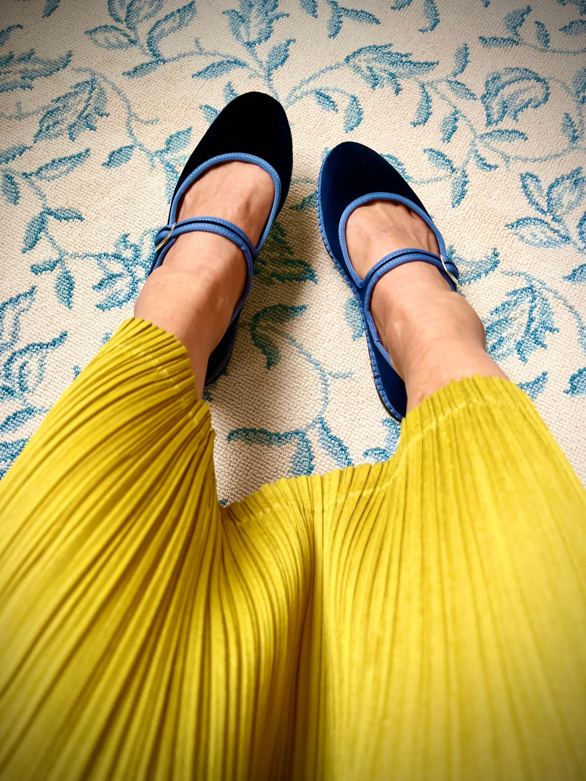 Navy Mary Jane flats with light blue strap and buckle shown on feet