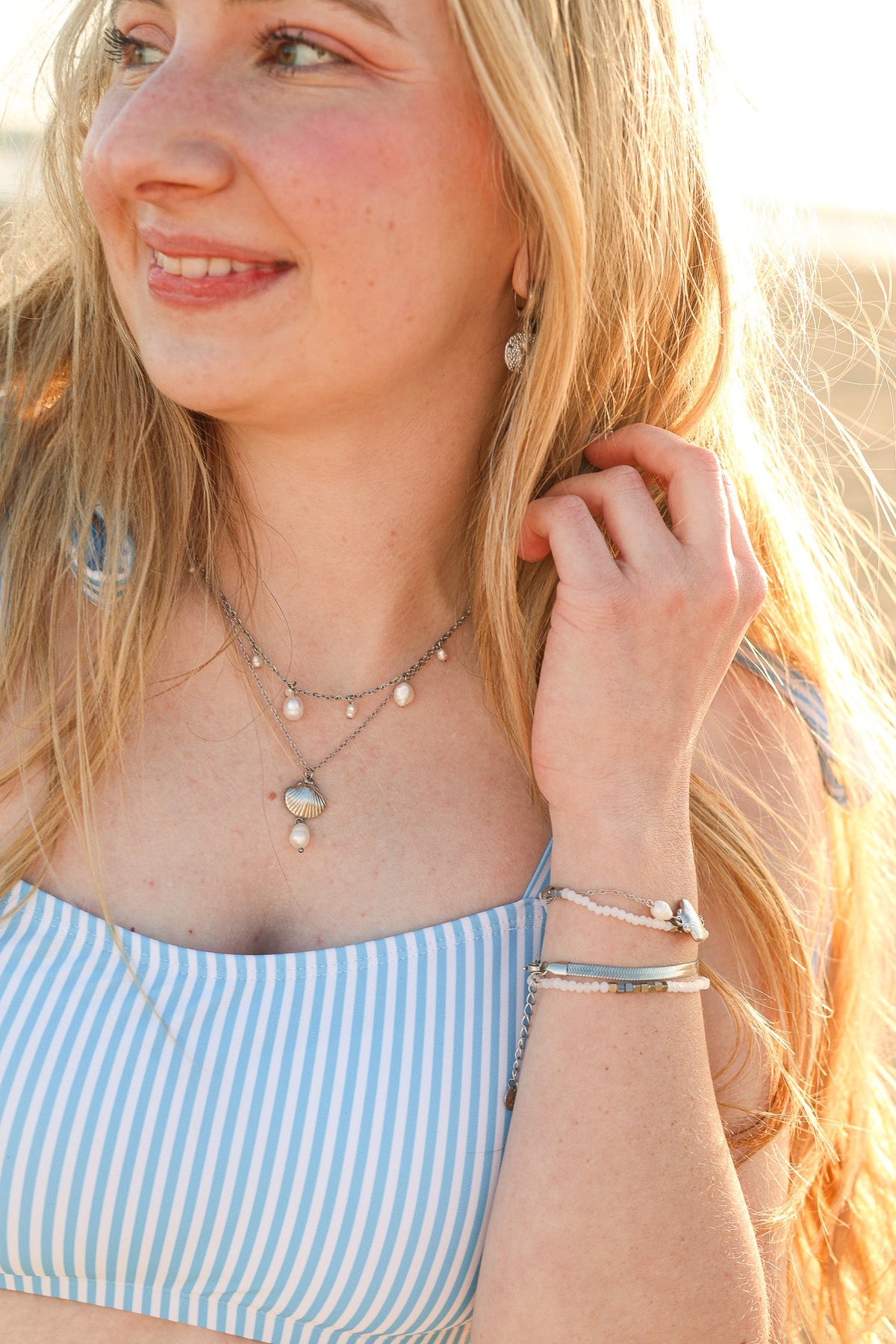 Silver Calypso Necklace with pearl drops and a central round pendant