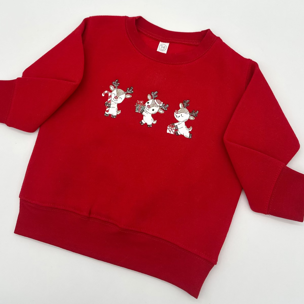 Red embroidered reindeer trio sweatshirt with long sleeves and crew neckline