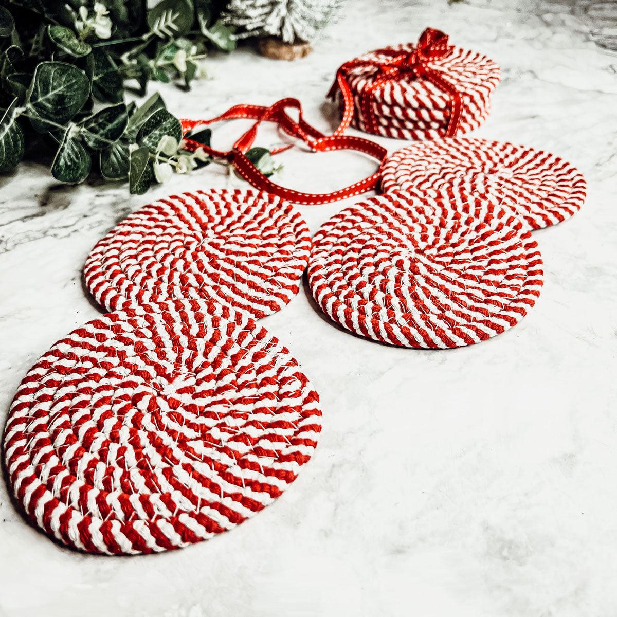Coaster set (4-pack) of round red-and-white striped coasters, bundled together