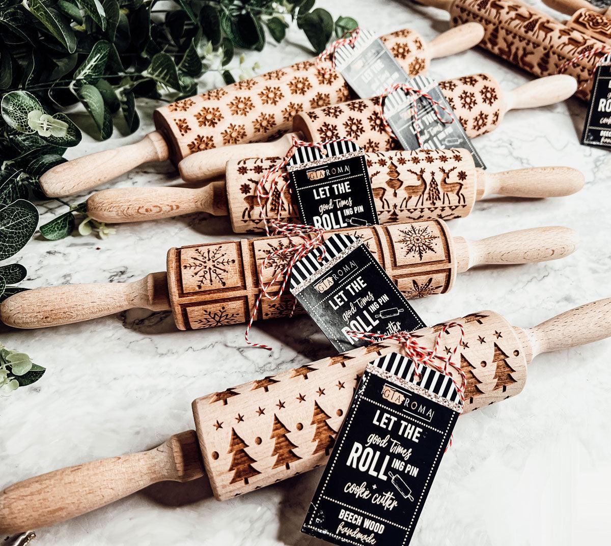 Assorted Christmas rolling pins with embossed designs in a bundle, each with wood handles