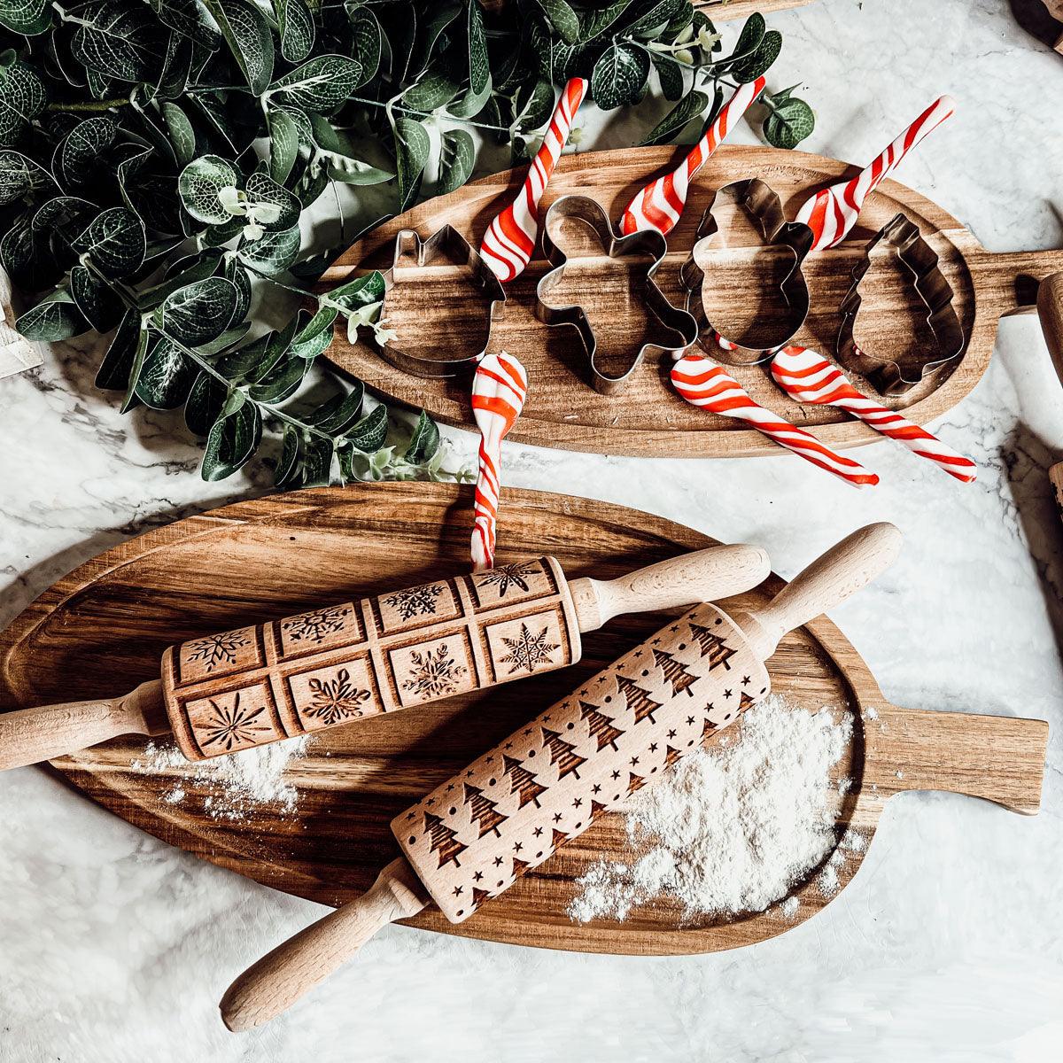 Wood rolling pin set with striped candy-cane style cutters and engraved winter designs