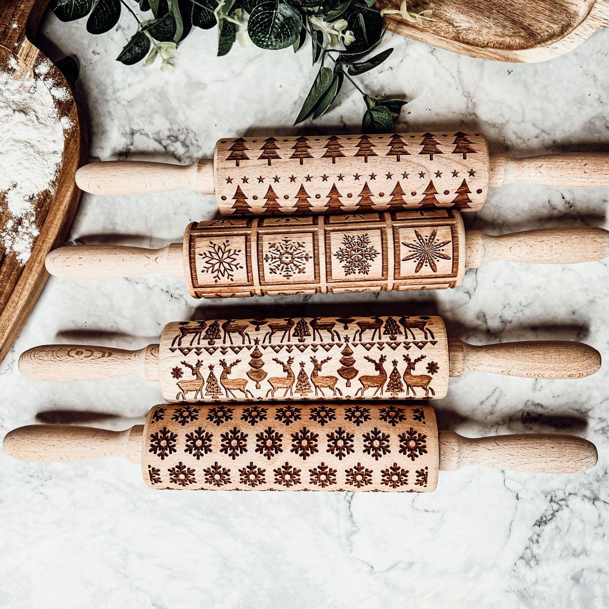 Christmas rolling pin set: four wooden rollers with snowflake, tree, and animal engravings