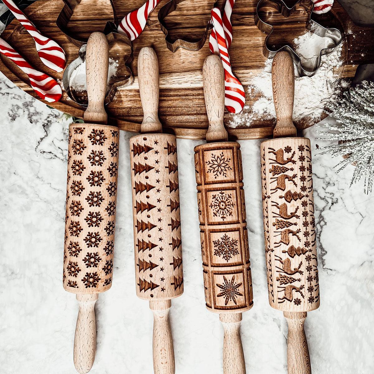 Set of wooden Christmas rolling pins with carved holiday patterns and striped accents