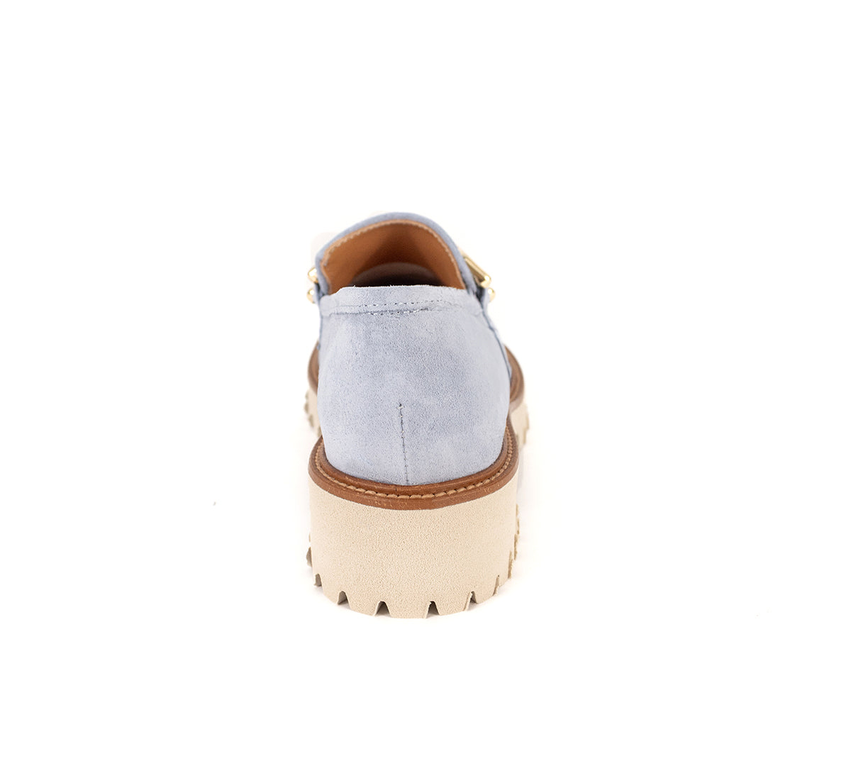 Rear view of a light blue suede loafer with a chunky cream sole