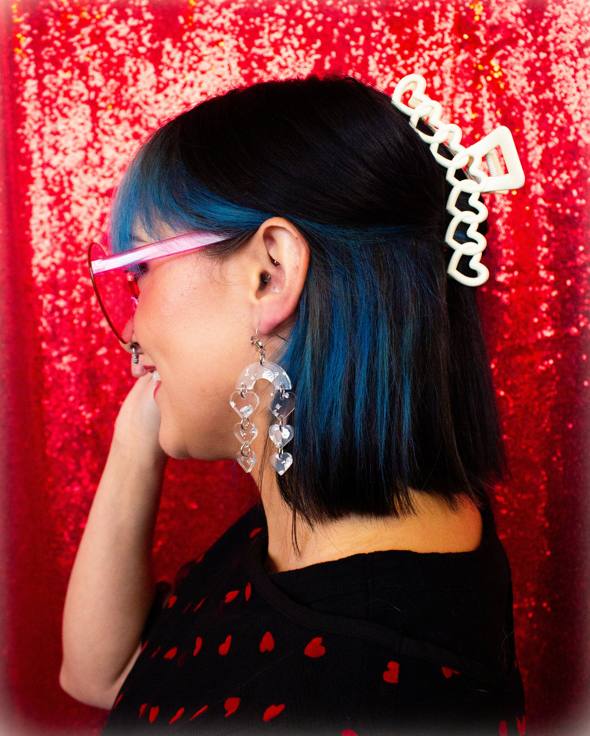 Heart hair claw clipped in dark hair, white clip with black zigzag trim