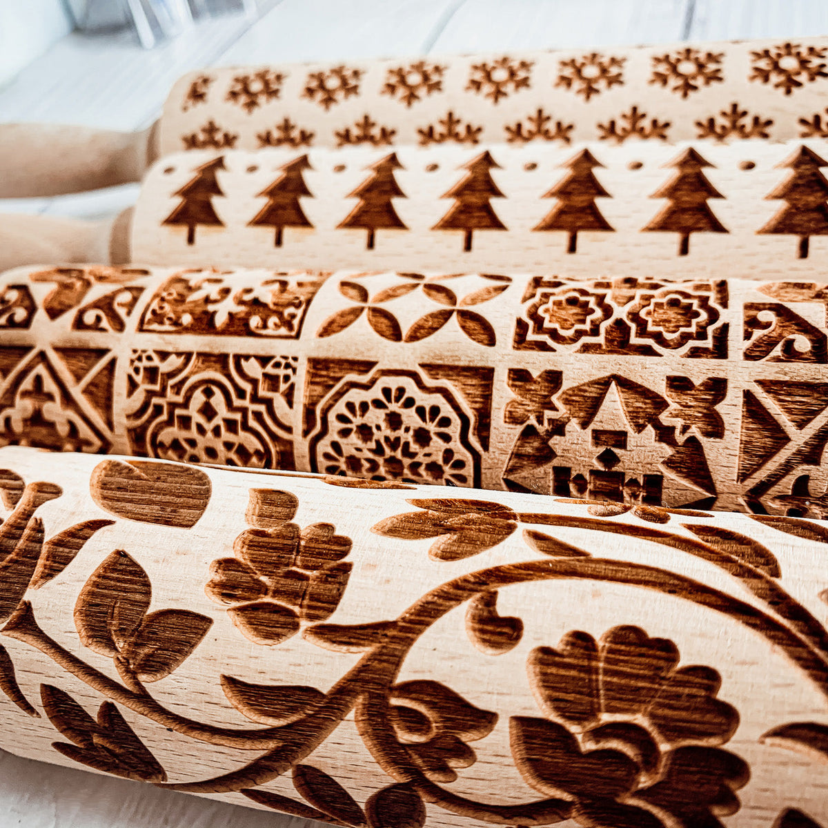 Close-up of brown patterned rolling pin sleeve with embossed decorative motifs