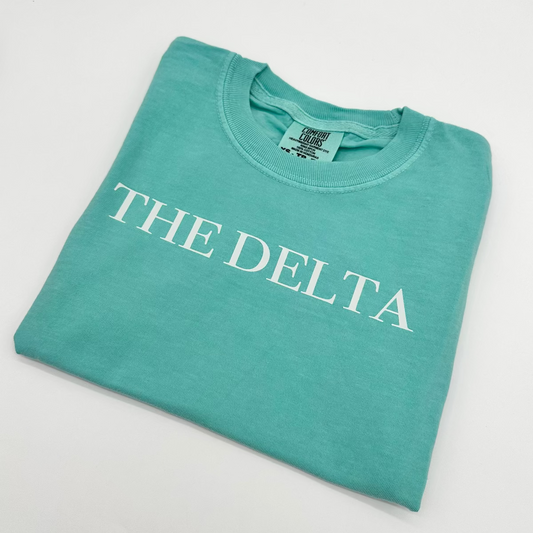 Teal youth T-shirt with 'THE DELTA' front graphic
