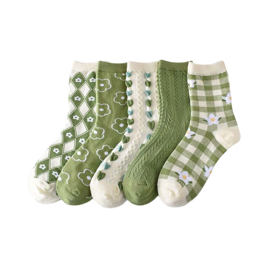 Set of green patterned crew socks with hearts, clover, plaid, and textured knit