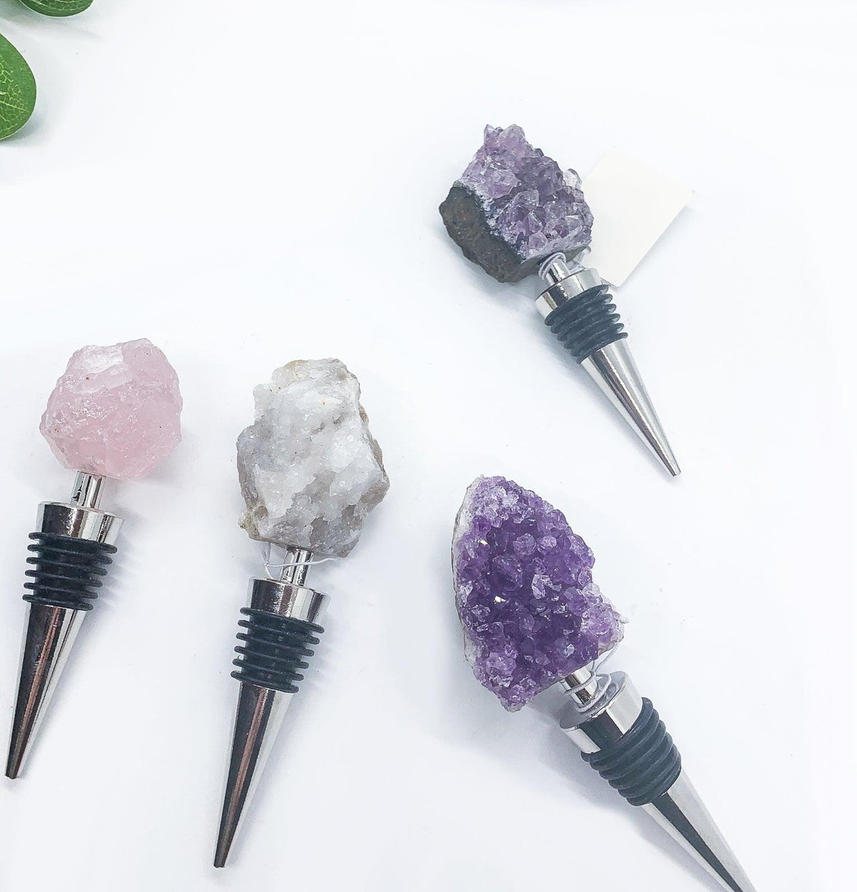 Naturally Bougie crystal bottle stopper set with pink, white, and purple rough stones