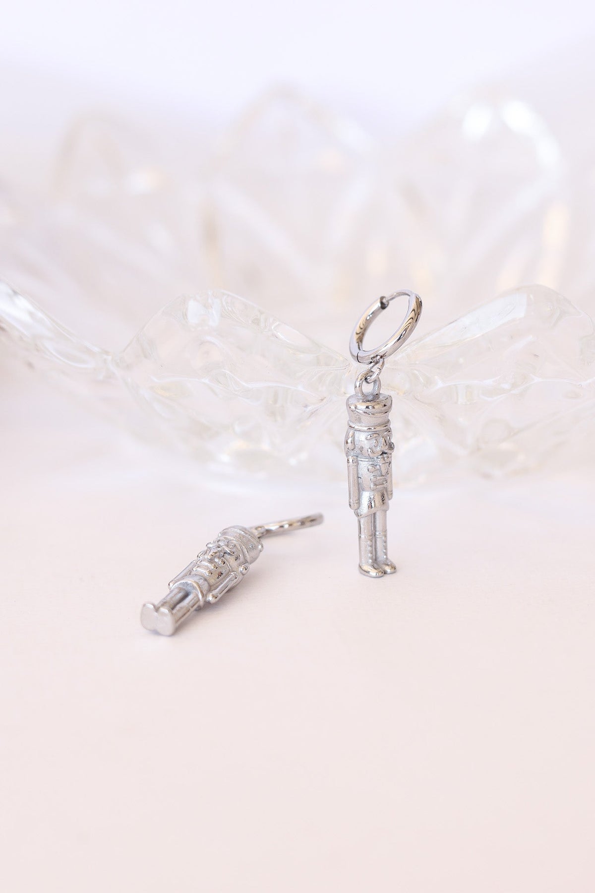 Silver nutcracker huggie hoop earrings with soldier charms