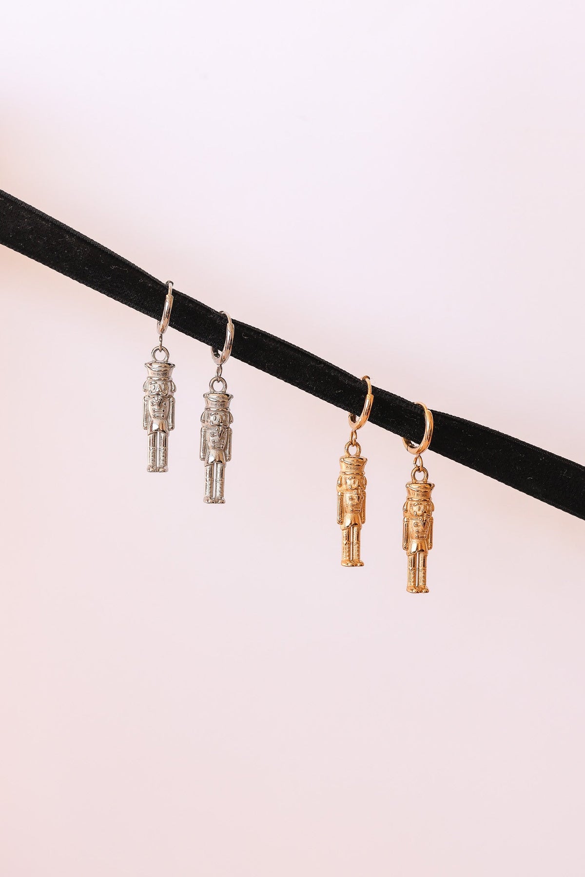 Nutcracker huggie hoop earrings in silver and gold