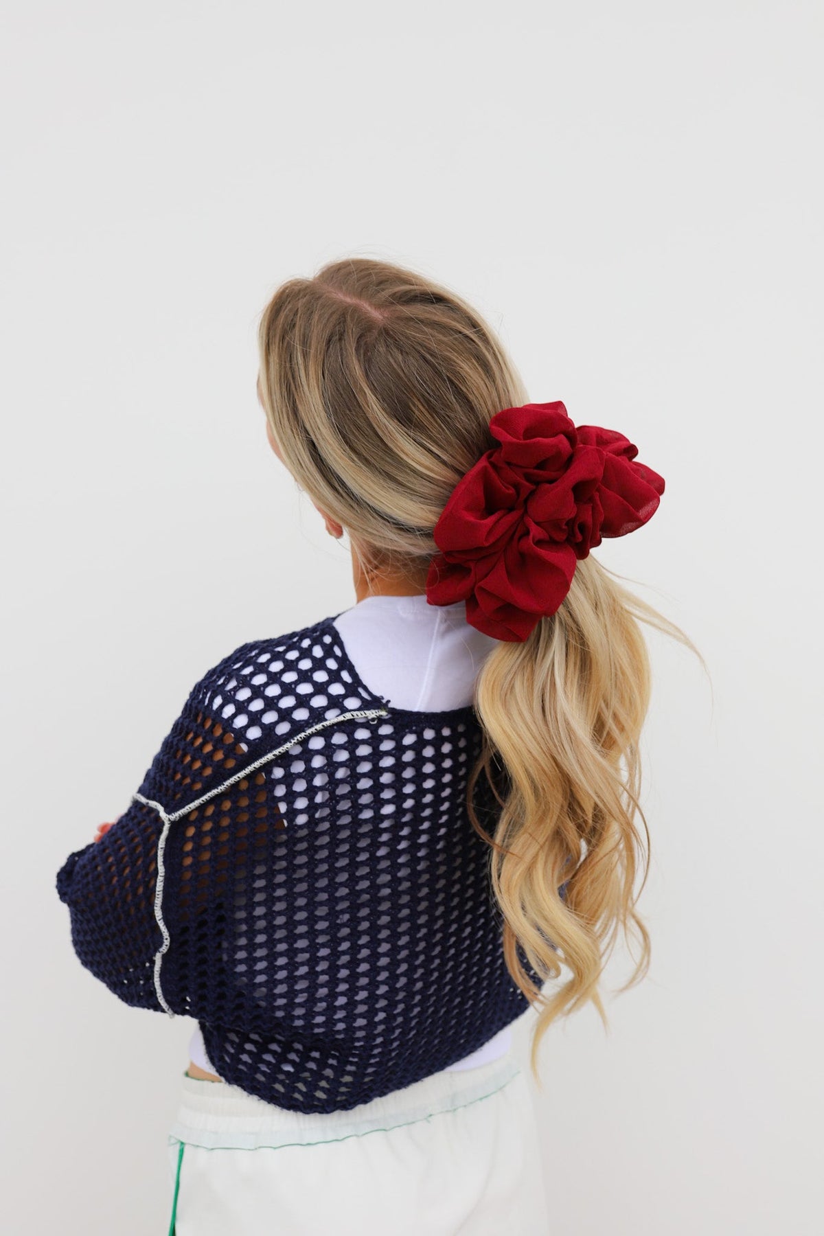 Jumbo scrunchie, deep red ruffled scrunchie on blonde hair