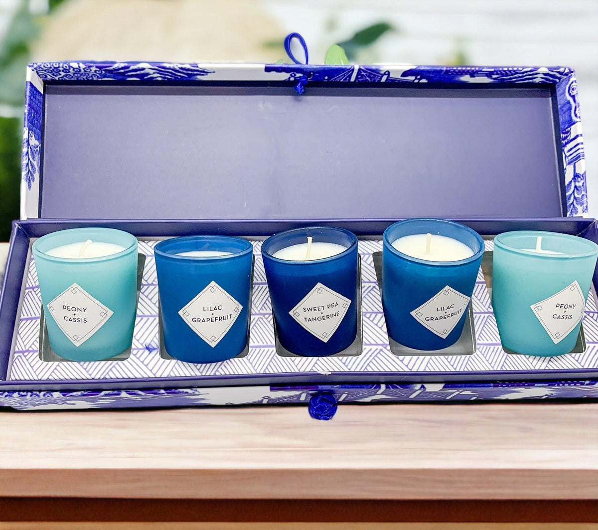 Mediterranean candle gift set open box showing five teal and blue candles
